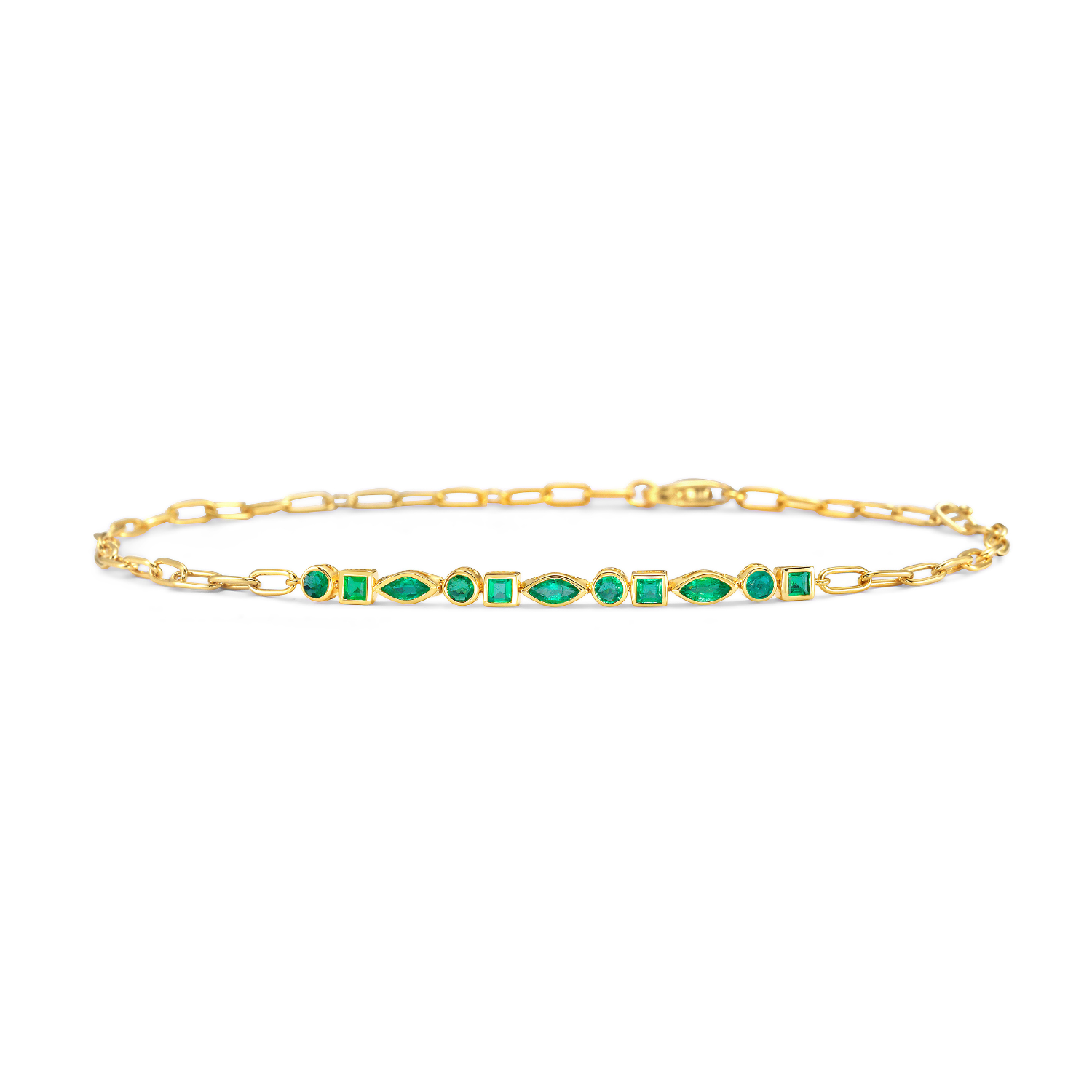 Gold bracelet with green gemstones on a white background