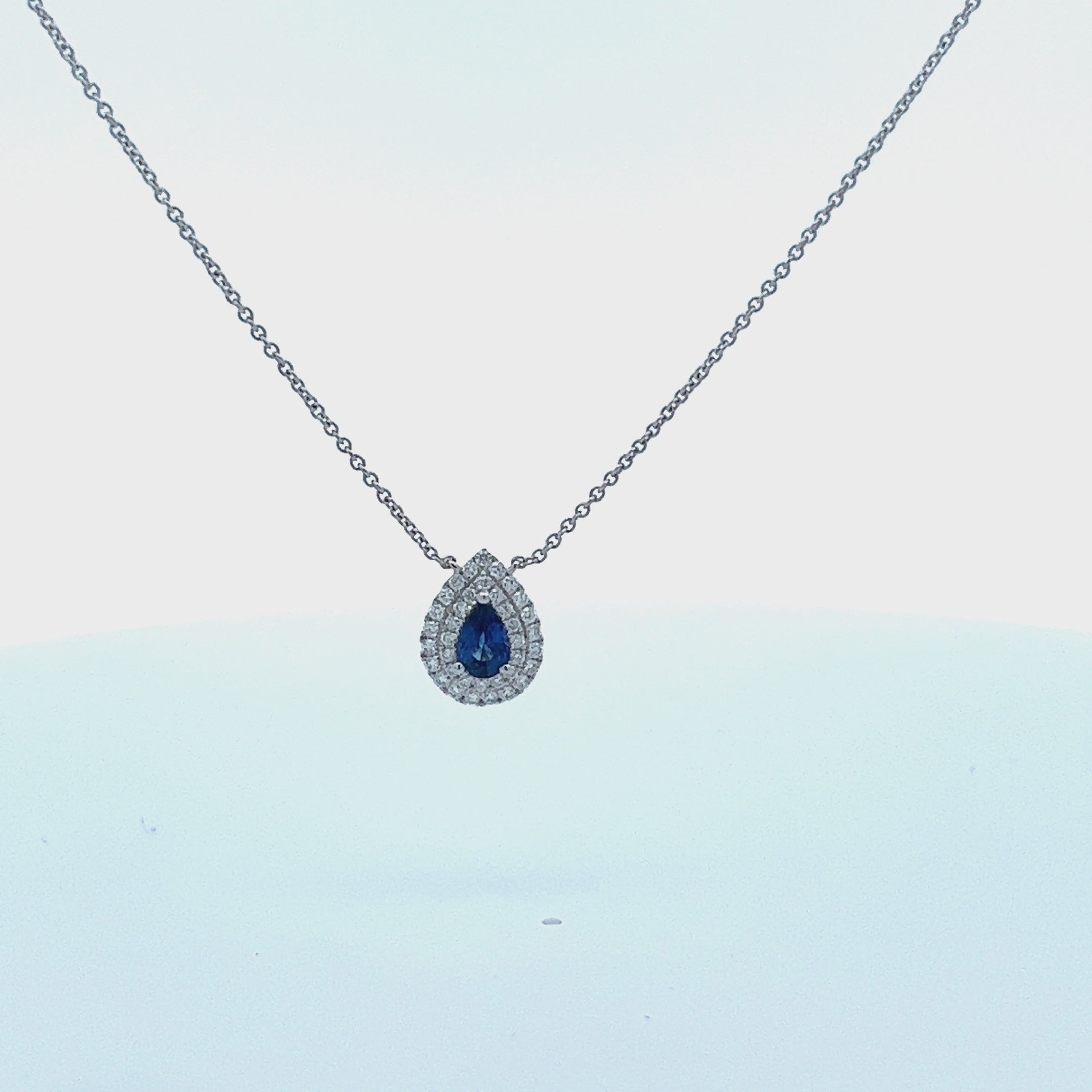 Pear Shape Blue Sapphire With Diamond Halo Necklace (0.73 ct.) in 18K Gold